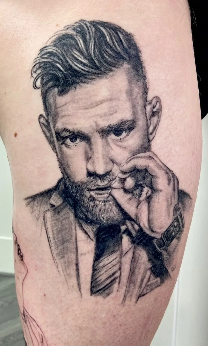 Realistisch portret-tattoo in zwart-grijs, gezet bij Milligan's Tattoo